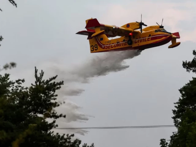 Blaze near Paris burns on as heatwave tightens across Europe