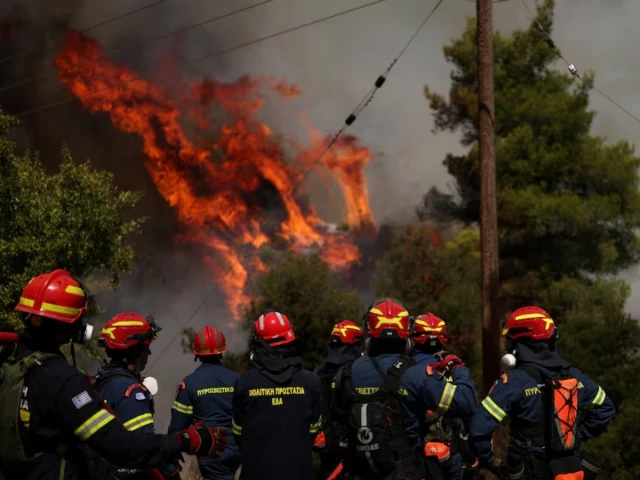 Two die as firefighting helicopters collide in Greece, French blaze changes course