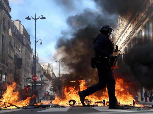 French police clash with protesters as tens of thousands rally over cost of living